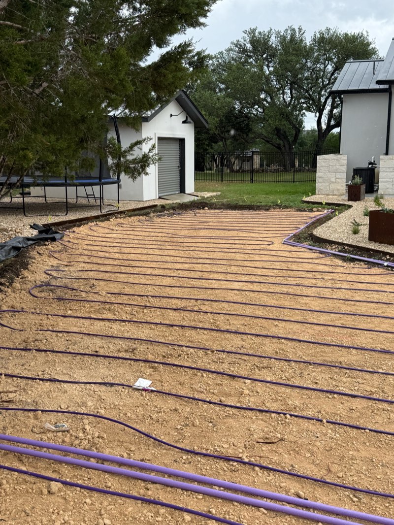Residential drip septic field beside a home